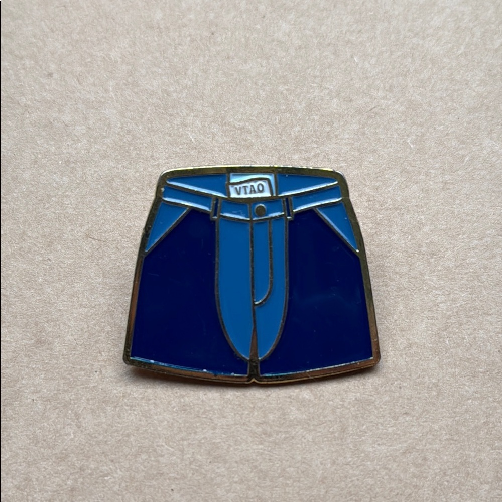 “Vote the Assholes Out” Patagonia Stand Up Shorts Enamel Pin